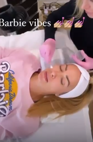 transforming hyperpigmentation skin, optimistic, receiving care, photorealistic, in a dermatologist office with sleek design, highly detailed, gentle hum of equipment, high resolution, muted greys, clinical bright white lights, shot with a 24-70mm lens.